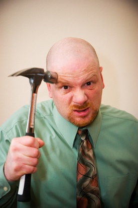 man-with-hammer-to-head.jpg